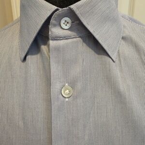 Three Suitsupply dress shirts